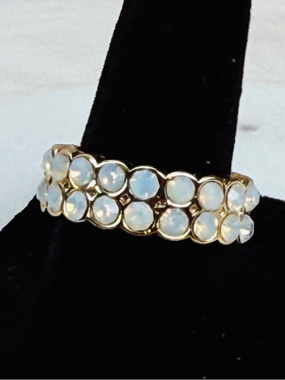 Goldtone, iridescent eternity band ring 7 1/4